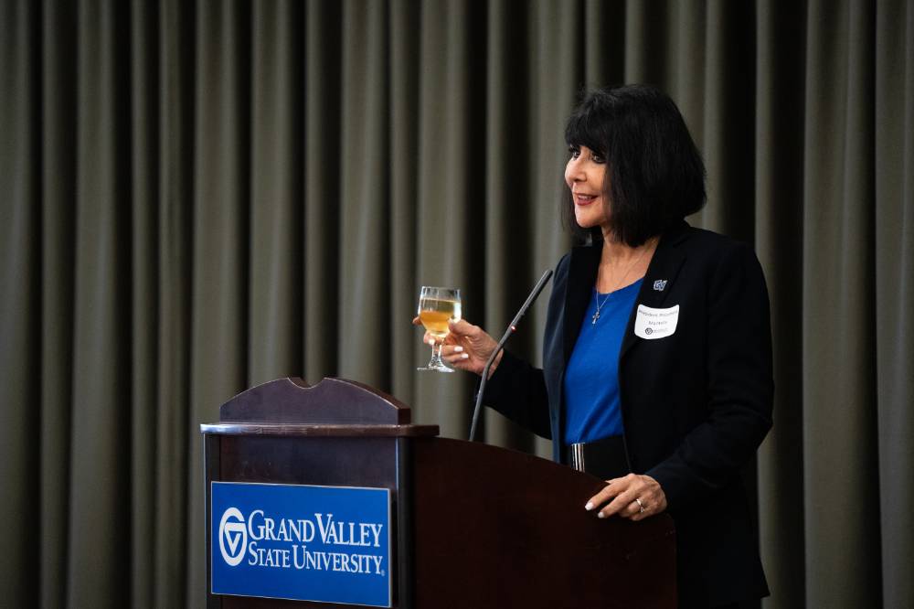 President Mantella giving speech with glass in hand